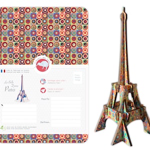 May include: A colorful 3D model of the Eiffel Tower made from wood. The model is made up of circles and squares in various colors, including red, yellow, blue, green, and orange. The model is 100 grams and is easy to assemble.