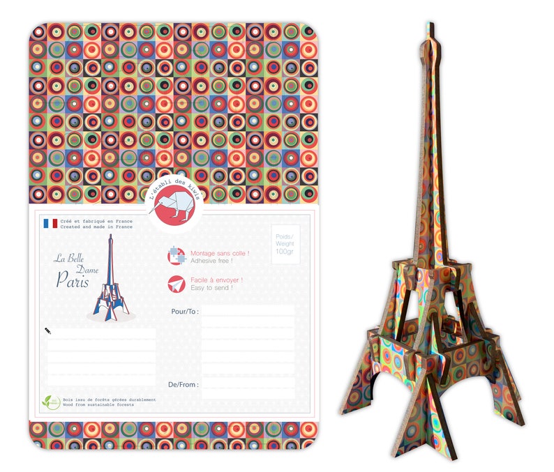 May include: A colorful 3D model of the Eiffel Tower made from wood. The model is made up of circles and squares in various colors, including red, yellow, blue, green, and orange. The model is 100 grams and is easy to assemble.