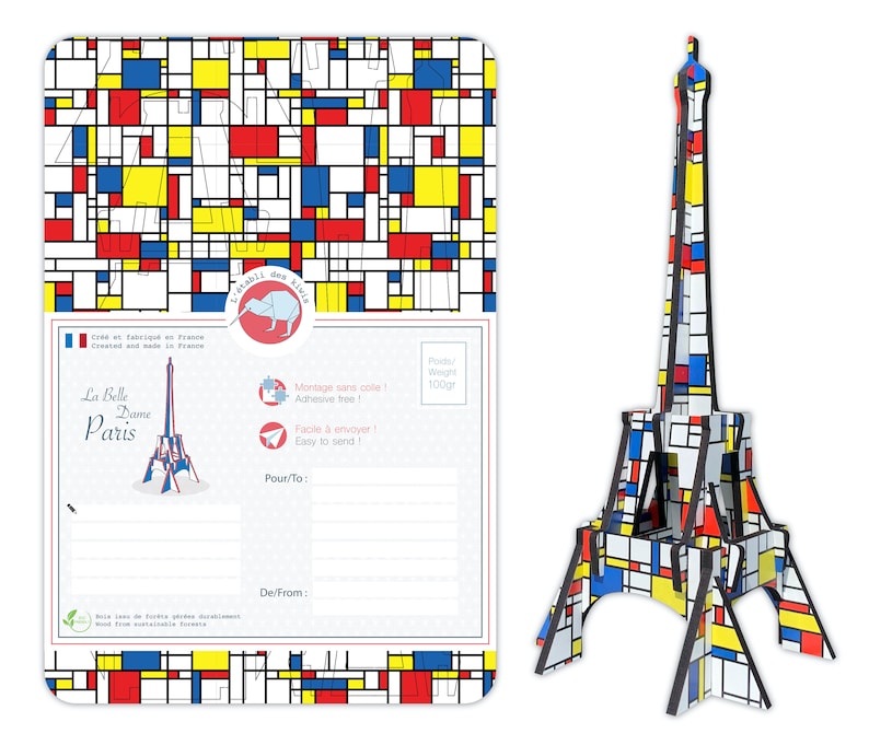 May include: A 3D model of the Eiffel Tower in Paris, France. The model is made of cardboard and is painted in a geometric pattern of red, yellow, blue, and white squares. The model is 100 grams and is easy to assemble.