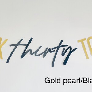 May include: Gold and black banner with the text "TALK thirty TO ME".
