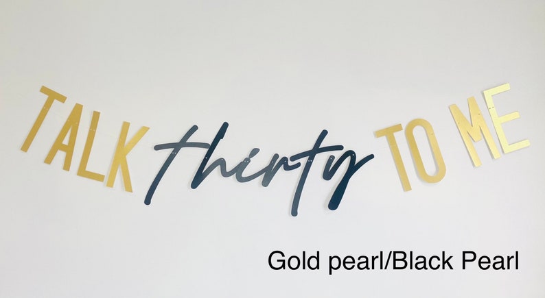May include: Gold and black banner with the text "TALK thirty TO ME".