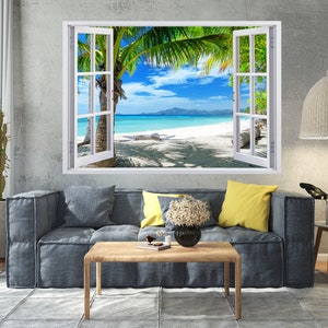 Puede incluir: Un marco de ventana blanco con vista a una playa tropical con palmeras, agua azul y arena blanca. La ventana está abierta y la escena está enmarcada por la ventana.