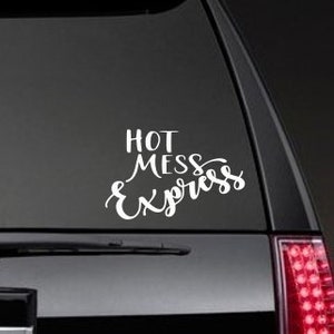 May include: White vinyl decal with the text "Hot Mess Express" on a black car.