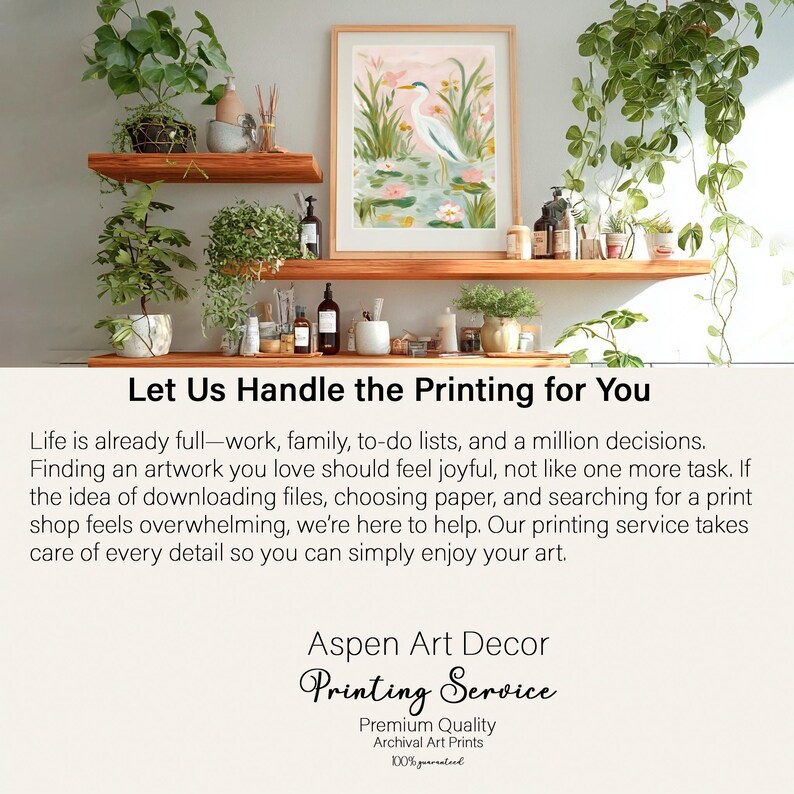 May include: A framed artwork featuring a white heron in a pond with pink water lilies. The artwork is displayed on a wooden shelf with various decorative items and plants. The text "Let Us Handle the Printing for You" is visible.