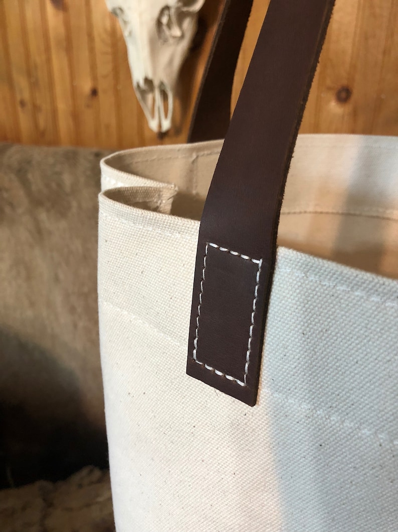 Natural canvas tote with dark brown leather straps