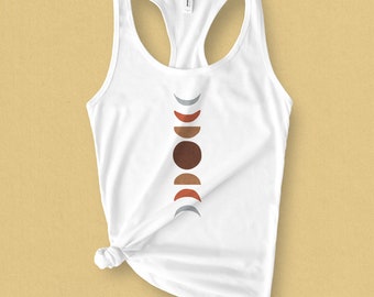 May include: White tank top with a graphic of a vertical row of different colored crescent moons. The moons are in shades of brown, red, and gray.