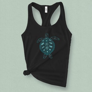May include: Black tank top with a teal blue sea turtle graphic. The turtle has a detailed design with a patterned shell.