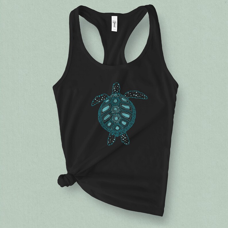 May include: Black tank top with a teal blue sea turtle graphic. The turtle has a detailed design with a patterned shell.