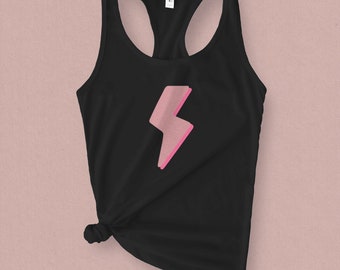 May include: Black tank top with a pink lightning bolt graphic.