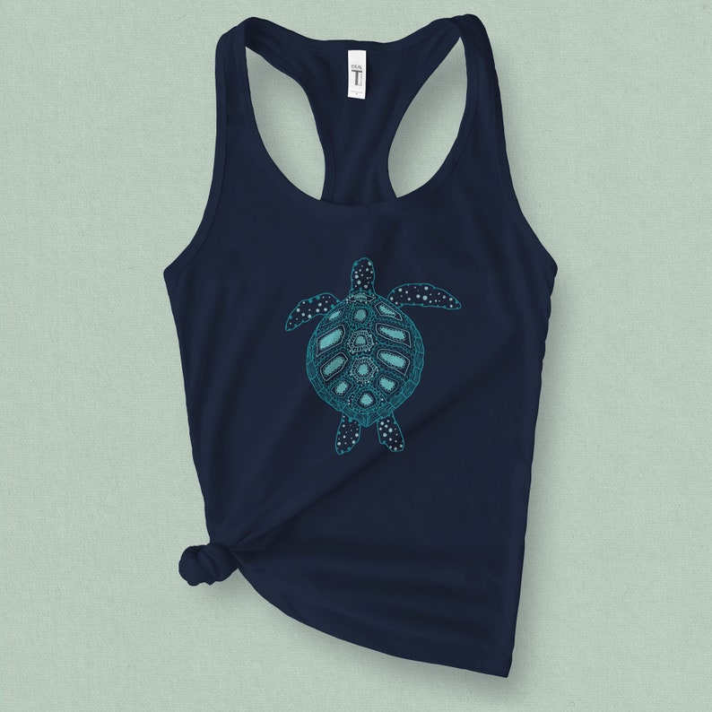 May include: A navy blue tank top with a teal blue graphic of a stylized sea turtle.