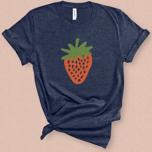 May include: A navy blue t-shirt with a red and green strawberry graphic.