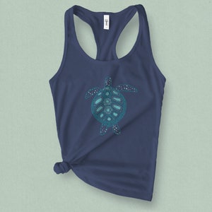 May include: A navy blue tank top with a teal green patterned sea turtle graphic.