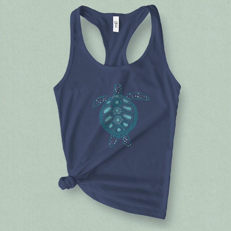 May include: A navy blue tank top with a teal green patterned sea turtle graphic.