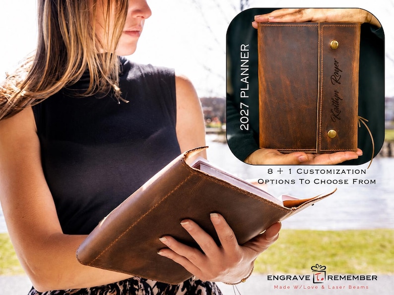 May include: A brown leather planner with a wrap-around closure secured by two brass-colored metal snaps. The cover features the text 2027 PLANNER and a personalized name engraving. The planner is shown open and closed with visible stitching.
