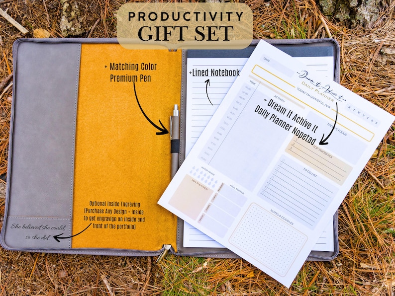 May include: A gray leather portfolio with a yellow interior, a lined notebook, a pen, and a daily planner with the text "Dream It Achieve It Daily Planner Notepad".