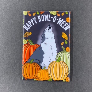 May include: A black and white wolf howling at the moon with the text "Happy Howl-O-Ween" in orange and yellow letters. The wolf is surrounded by pumpkins with orange, yellow, and green colors.