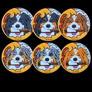 May include: Six round coasters featuring cartoon Australian Shepherd dogs with different colored fur. Each dog is holding a cigar in its mouth and is surrounded by a yellow wave design. The text "THE CLOUDY COR" is printed on each coaster.