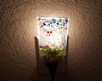 Sparkling Fused glass nightlight displaying white dog with brown spots.