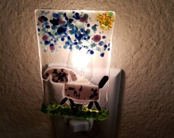 Fused glass nightlight with Gray dog with black spots.