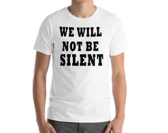 May include: White t-shirt with black text that reads "We Will Not Be Silent".