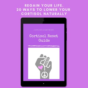 May include: A tablet displays a purple screen with the text "REGAIN YOUR LIFE. 20 WAYS TO LOWER YOUR CORTISOL NATURALLY." The screen also shows "Cortisol Reset Guide" and a graphic of a fist with a heart and peace sign.