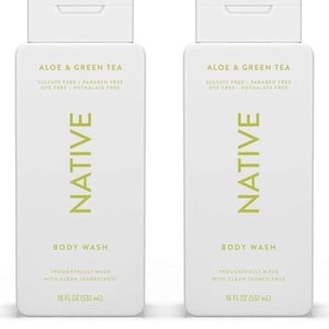 May include: Two white body wash bottles with flip-top caps. The bottles have the text "ALOE & GREEN TEA" and "NATIVE" in green. Each bottle contains 18 fl oz (532 mL) of body wash.