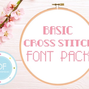 Puede incluir: Un aro de bordado blanco con una fuente de punto de cruz rosa que dice "BASIC CROSS STITCH FONT PACK". Un círculo azul y blanco con la palabra "PDF" y el texto "Descarga instantánea" se encuentra en la esquina inferior izquierda de la imagen.