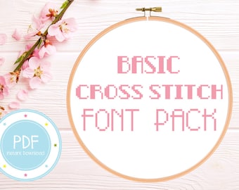 May include: A white embroidery hoop with a pink cross stitch font that reads "BASIC CROSS STITCH FONT PACK". A blue and white circle with the word "PDF" and the text "Instant Download" is in the lower left corner of the image.