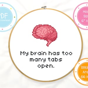 May include: A cross-stitch pattern featuring a pixelated brain with the text "My brain has too many tabs open." The pattern is designed for a 6-inch embroidery hoop and has a stitched area of 66 by 56 stitches.