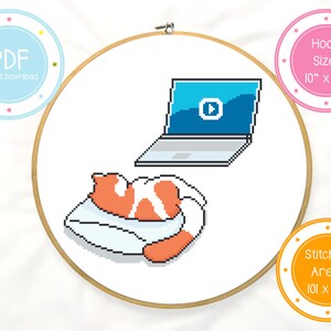 May include: Cross stitch pattern featuring a cat sleeping on a pillow with a laptop in the background. The pattern is designed for a 10 inch hoop and has a stitched area of 101 x 96 stitches.