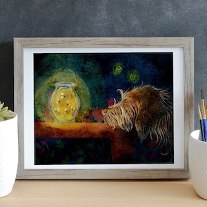 May include: A framed watercolor painting of a dog looking at a jar of fireflies. The jar is on a wooden table and the dog is in the background. The painting has a dark blue background with green and yellow accents.