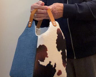 Denim and faux cowhide bucket bag