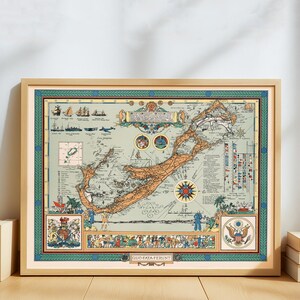 May include: Framed vintage map of Bermuda, featuring detailed illustrations of ships, aircraft, and historical symbols. The map has a light green background with a brown landmass and is encased in a wooden frame with a green border. The text "QUO FATA FERUNT" is at the bottom.