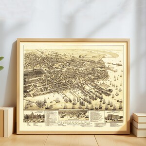 May include: A framed vintage map of Pensacola, Florida, in sepia tones. The detailed illustration shows the city's layout, including buildings, streets, and the harbor filled with ships. The text "PENSACOLA, FLA." is visible at the bottom.