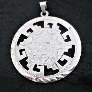 A large vintage 925 silver Mexican Aztec design pendant