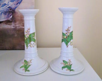 A pair of antique Victorian ceramic candlesticks decorated with Lily of the Valley
