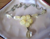 A vintage silver tone and glitter lucite flower necklace