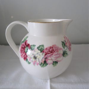 A very pretty vintage Crown Staffordshire Bone China Milk Jug with rose decoration - English 1950&#39;s