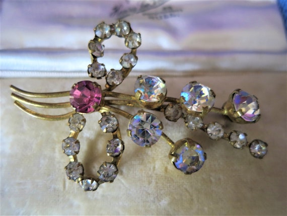 A vintage diamond and ruby paste gold tone brooch - image 2