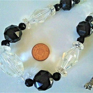 An antique faceted rock crystal and French jet bead on chain necklace