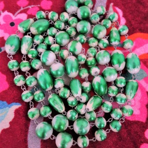 An unusual vintage flapper length Lucite bead chain linked ivory and green bead necklace