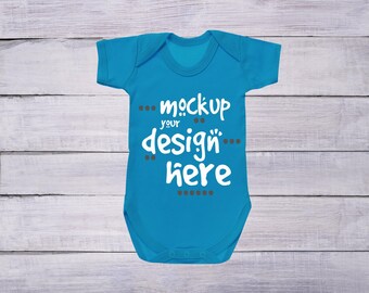 Bodysuit Mockup Sapphire Blue Bodysuit On White Wood Baby Clothing Mockup Blue Baby Bodysuit Mockup Blue Infant Bodysuit Mockup Book Mockup Vectors Photos And Psd Files