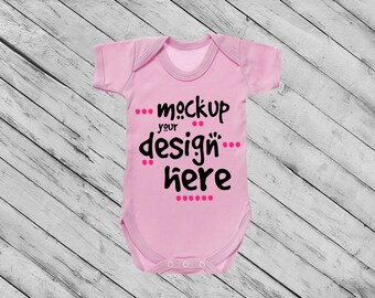 Download Bodysuit Mockup Light Pink Bodysuit On White Weathered Wood Baby Clothing Mockup Pink Baby Bodysuit Mockup Pink Infant Bodysuit Mockup Psd Screen Imac Pro Mockup Free All Free Mockups PSD Mockup Templates