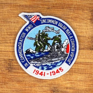 May include: Embroidered patch with a circular design commemorating WWII. Features a depiction of soldiers, an American flag, and the text "Uncommon Valor Was a Common Virtue" and "1941-1945". The patch is white with blue, green, red, and gray accents.