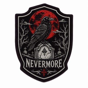 May include: A shield-shaped embroidered patch featuring a black raven perched on a tombstone against a large red moon. The design includes bare trees, smaller gravestones, and the word NEVERMORE in white text with a small red cross symbol below.