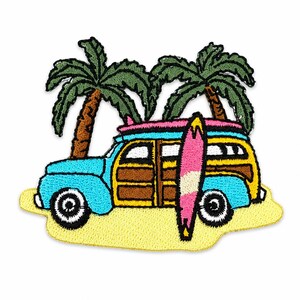 May include: An embroidered patch featuring a light blue woody station wagon parked on yellow sand. A pink and white surfboard leans against the side of the vehicle. Two green palm trees with brown trunks stand behind the car against a white background.