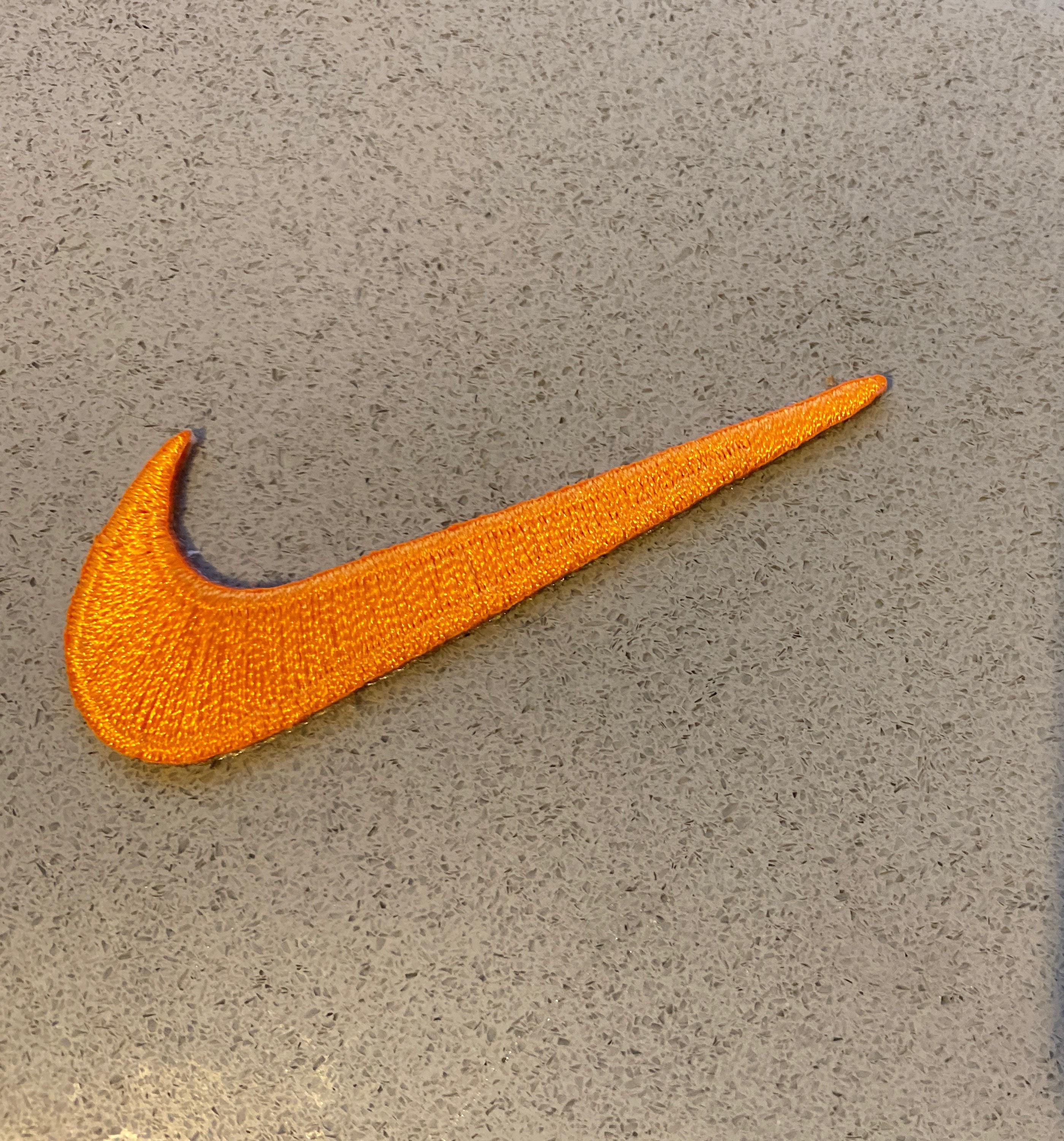 white nikes with orange swoosh