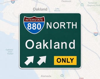 May include: A dark green rectangular road sign featuring the Interstate 880 shield in red, white, and blue. The sign displays the white text NORTH and Oakland, with two white upward-pointing arrows and a yellow rectangular box containing the word ONLY.