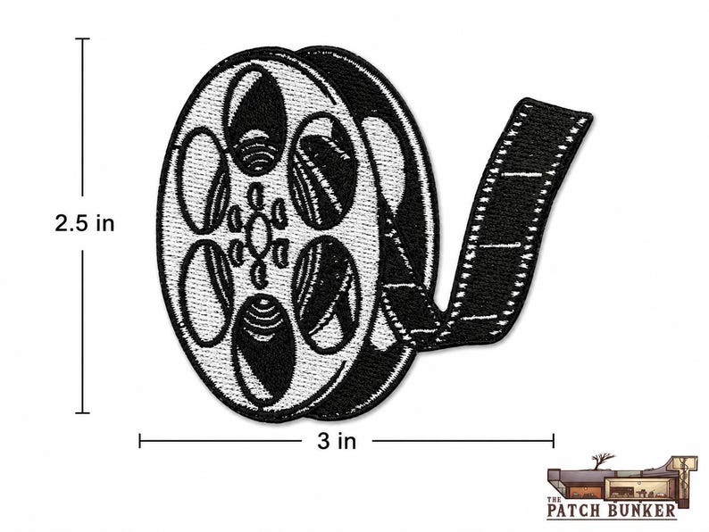 Black and white film reel embroidered patch shown on a white background with size markers indicating 3 inches wide by 2.5 inches tall, with the Patch Bunker logo in the lower right corner.