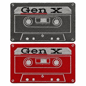 May include: Two rectangular embroidered patches shaped like cassette tapes. One patch is black and the other is red. Both feature a silver top section with the text Gen X in black, two circular spools, and white outlines of tape details.